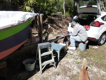 Hugh arguing with trailer lights. Fuzzknuckle the cat leaving in disgust from his attitude.